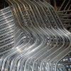 Special aluminium extrusion with four bends forming the shape of seat frame